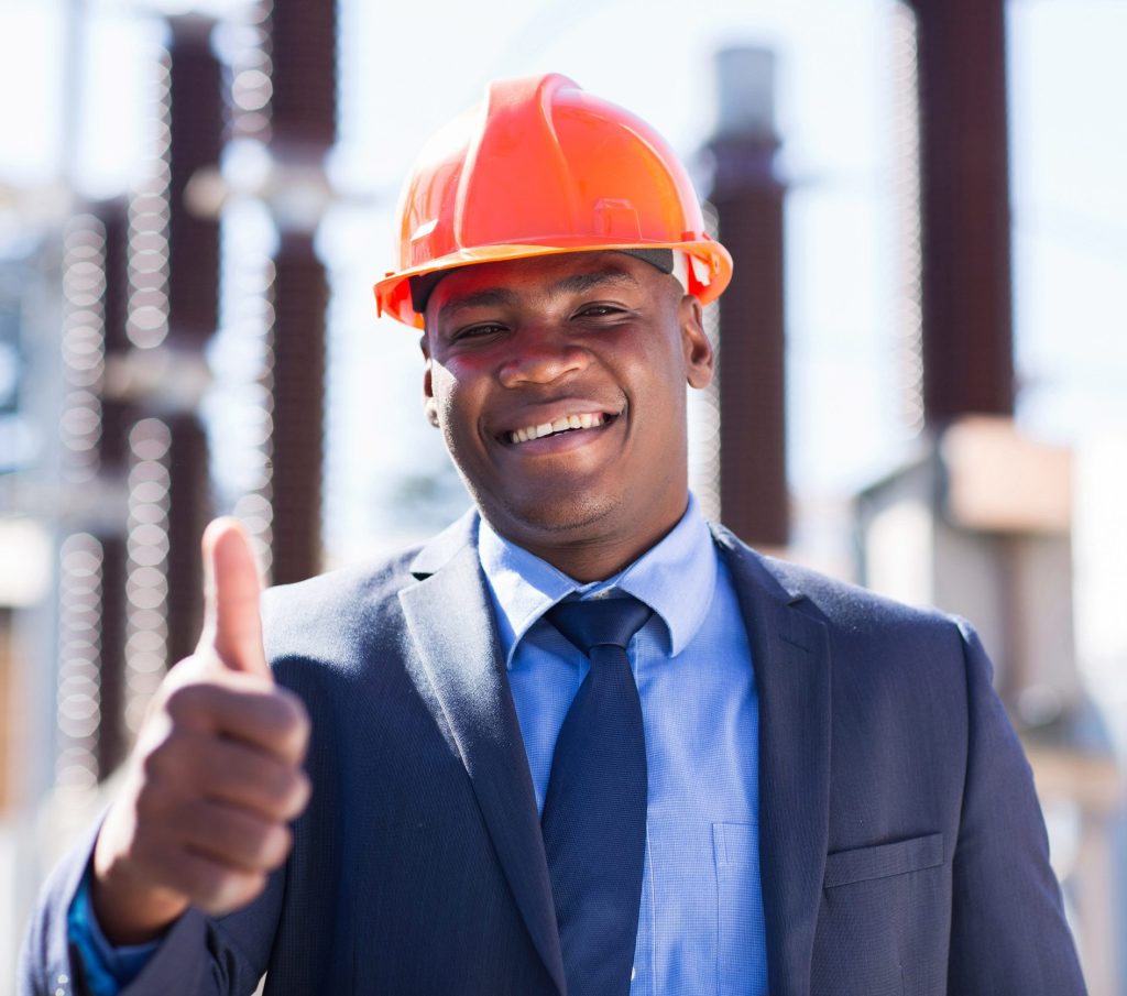 happy african industrial manager with thumb up at substation